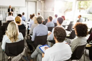 Sales manager tracking coaching ROI metrics including quota attainment, win rate, and deal size on a performance dashboard
